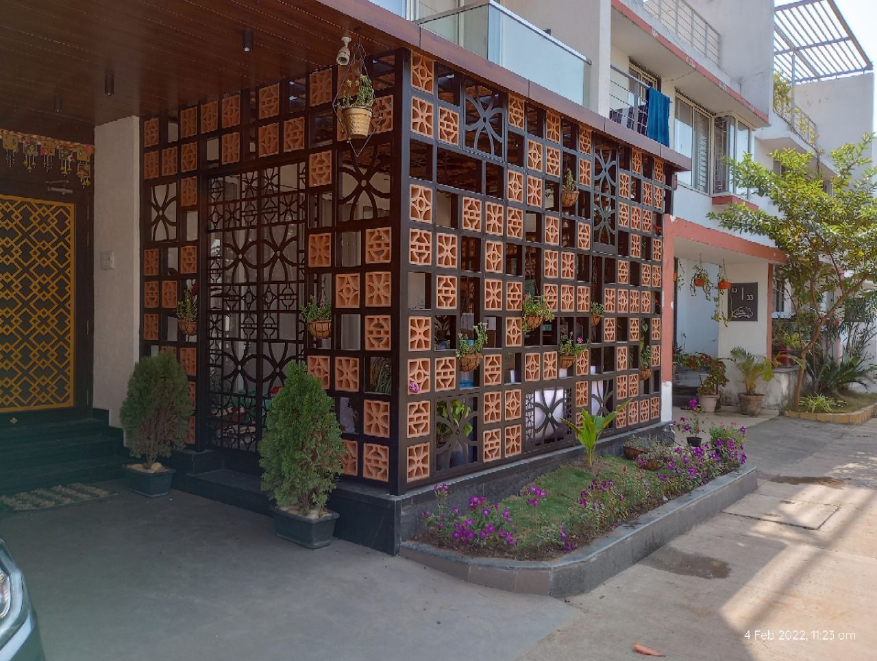 Corner exterior detail with terracotta jaali blockwork and steel framing