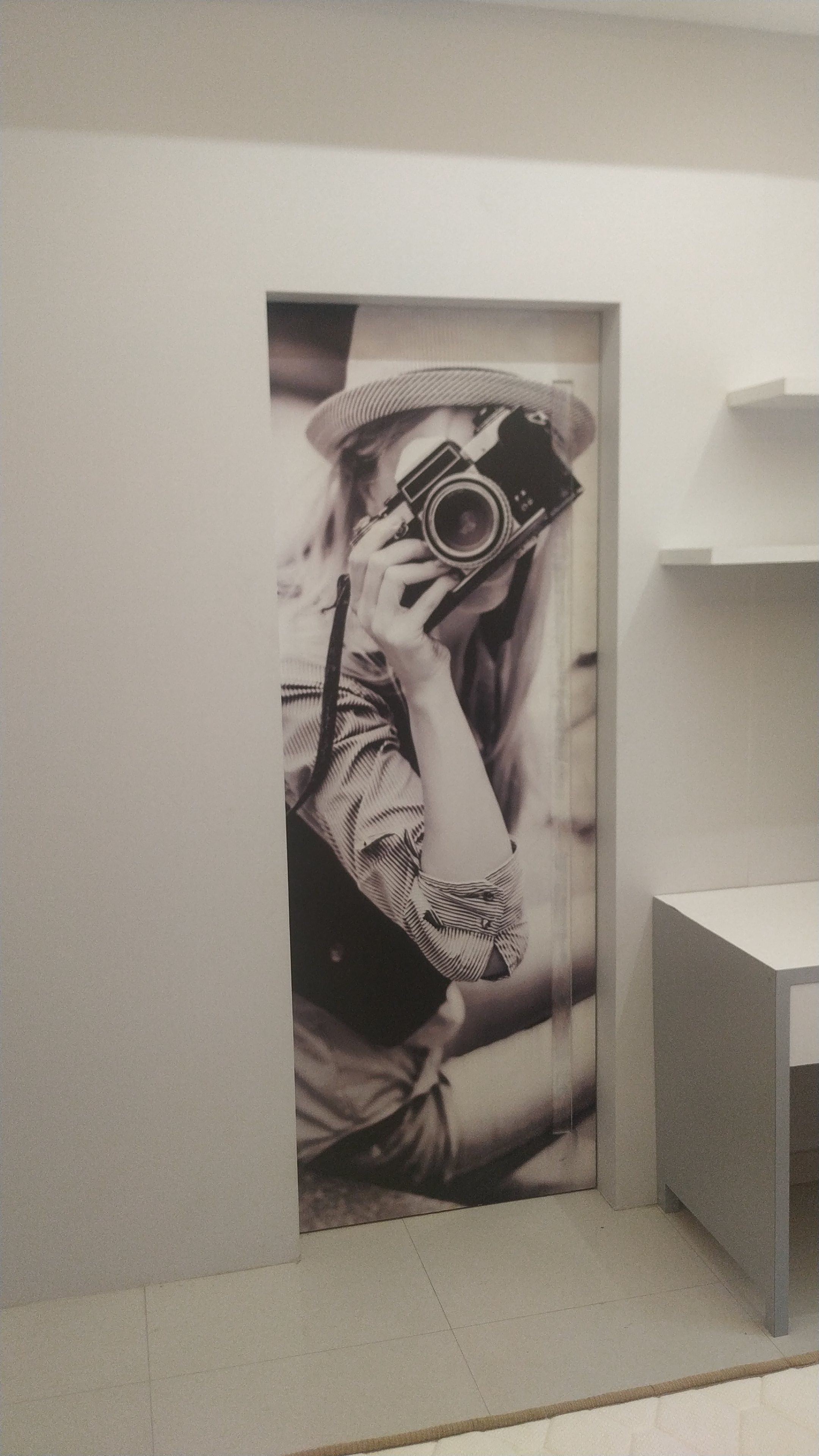 Vintage camera photo mural set into a study nook doorway